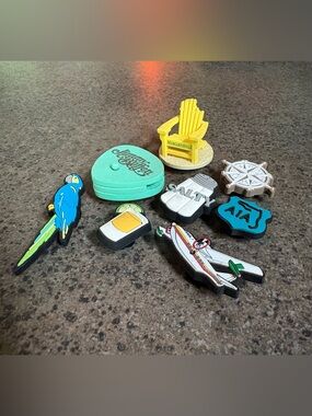 Croc charms- ALL things Jimmy Buffet! A real guitar pick too!! Very sassy.